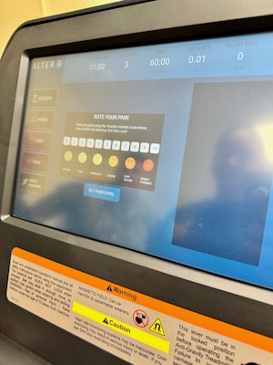 While exercising the treadmill rates the patient's pain.