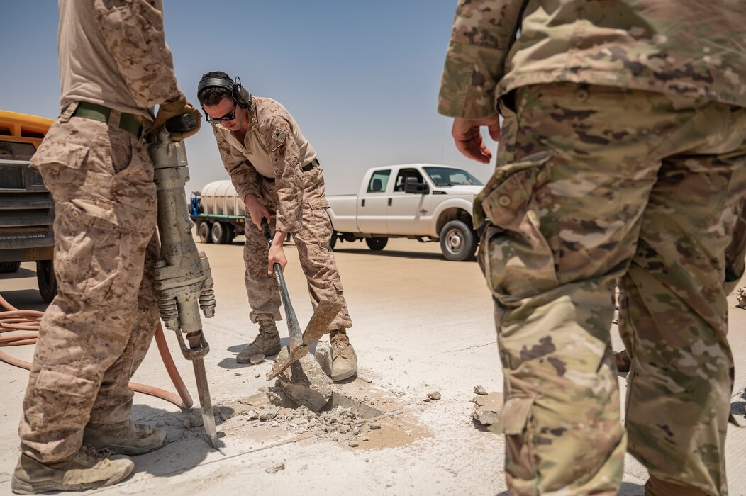 U.S. Department of Defense service members repair the flightline at an undisclosed location within the U.S. Central Command area of responsibility, May 4, 2024. Total force integration with the U.S. Marine Corps demonstrates the U.S.’ enduring commitment to global security. (U.S. Air Force photo)