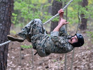Hospital Corpsman 1st Class Michael O’Connell, a special operations independent duty corpsman and instructor with the Naval Special Operations Medical Institute at the Joint Special Operations Medical Training Center, U.S. Army John F. Kennedy Special Warfare Center and School, negotiates an obstacle during the 2024 USAJFKSWCS Best Warrior Competition held at Camp Mackall, North Carolina, April 17, 2024. O’Connell was the only Navy competitor and took first place in the noncommissioned officer category of the competition, which challenges the competitors on various Soldier tasks including land navigation, oral board, swim test, ruck march, cognitive test, obstacle course and written exam. (U.S. Army photo by K. Kassens)