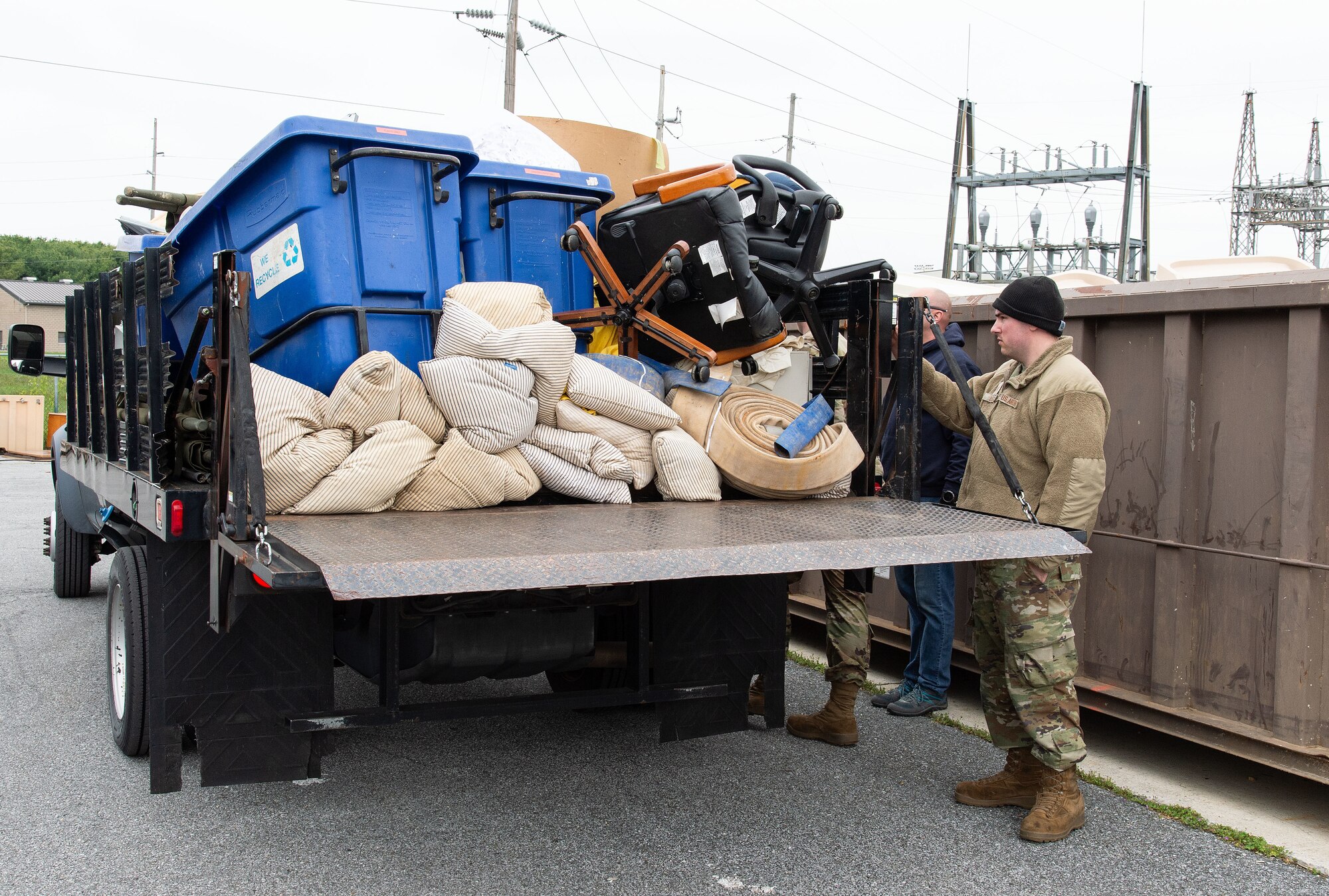 A U.S. Airmen prepares to unload unwanted items during the Recycling Center Open House at Dover Air Force Base, Delaware, April 18, 2024. Squadrons from across the base turned in unwanted and excess items to the center for proper disposition. (U.S. Air Force photo by Roland Balik)