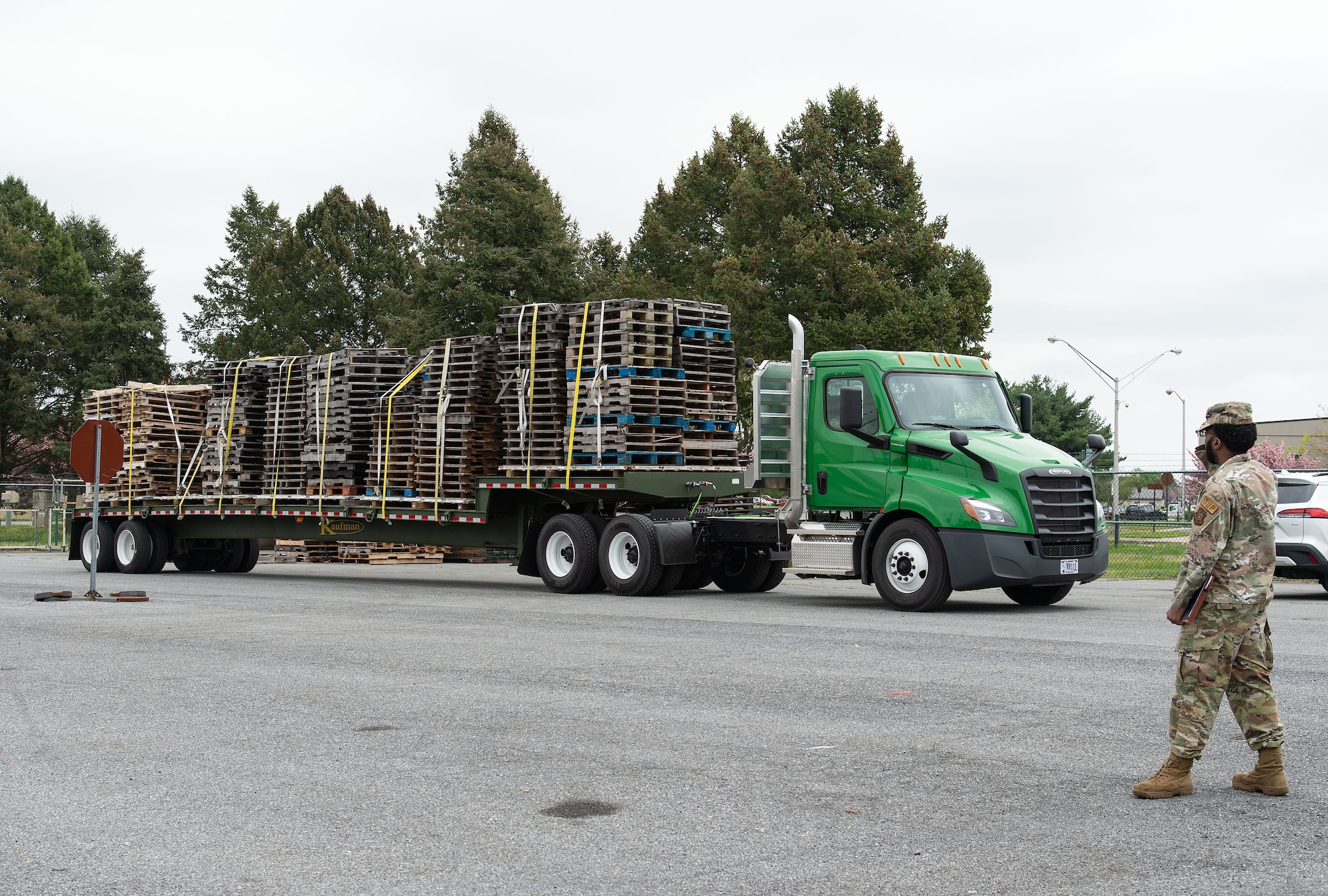A trailer loaded with unwanted wooden pallets arrives at the Recycling Center Open House on Dover Air Force Base, Delaware, April 18, 2024. Squadrons from across the base turned in unwanted and excess items to the center for proper disposition. (U.S. Air Force photo by Roland Balik)