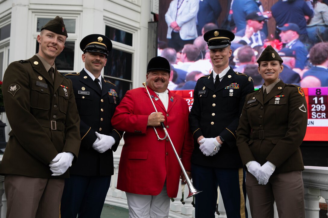 Soldiers of the 940th Military Police Company, 149th Maneuver Enhancement Brigade guard the winner’s trophy at the 150th Kentucky Derby at Churchill Downs, Louisville, Kentucky, May 4, 2024. The Kentucky Army National Guard carries a long tradition of escorting the winner’s cup dating back decades. (U.S. Army National Guard photo by Sergeant Caleb Sooter)
