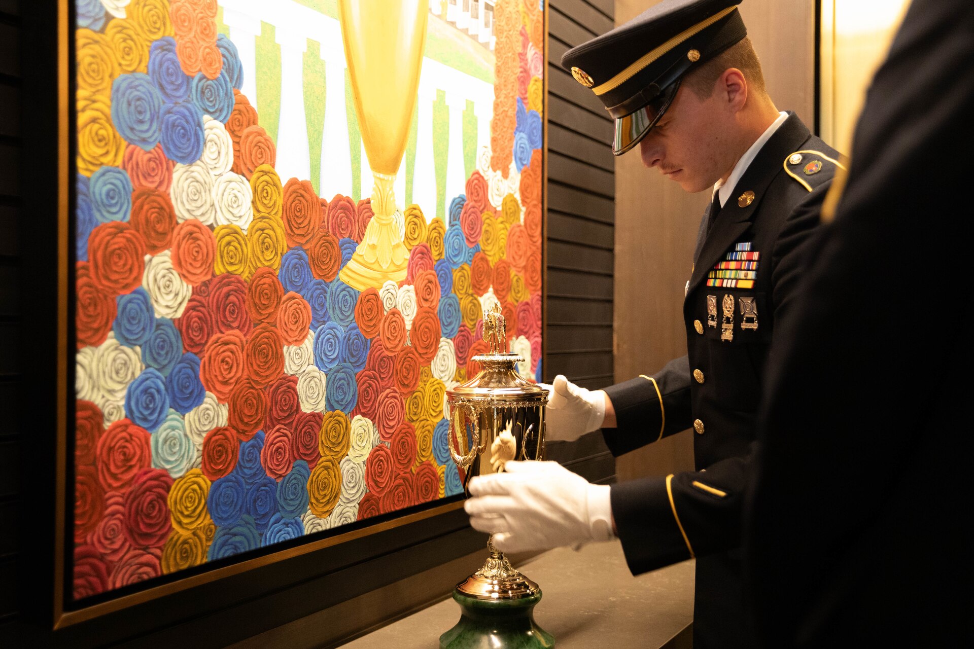 Soldiers of the 940th Military Police Company, 149th Maneuver Enhancement Brigade guard the winner’s trophy at the 150th Kentucky Derby at Churchill Downs, Louisville, Kentucky, May 4, 2024. The Kentucky Army National Guard carries a long tradition of escorting the winner’s cup dating back decades. (U.S. Army National Guard photo by Sergeant Caleb Sooter)