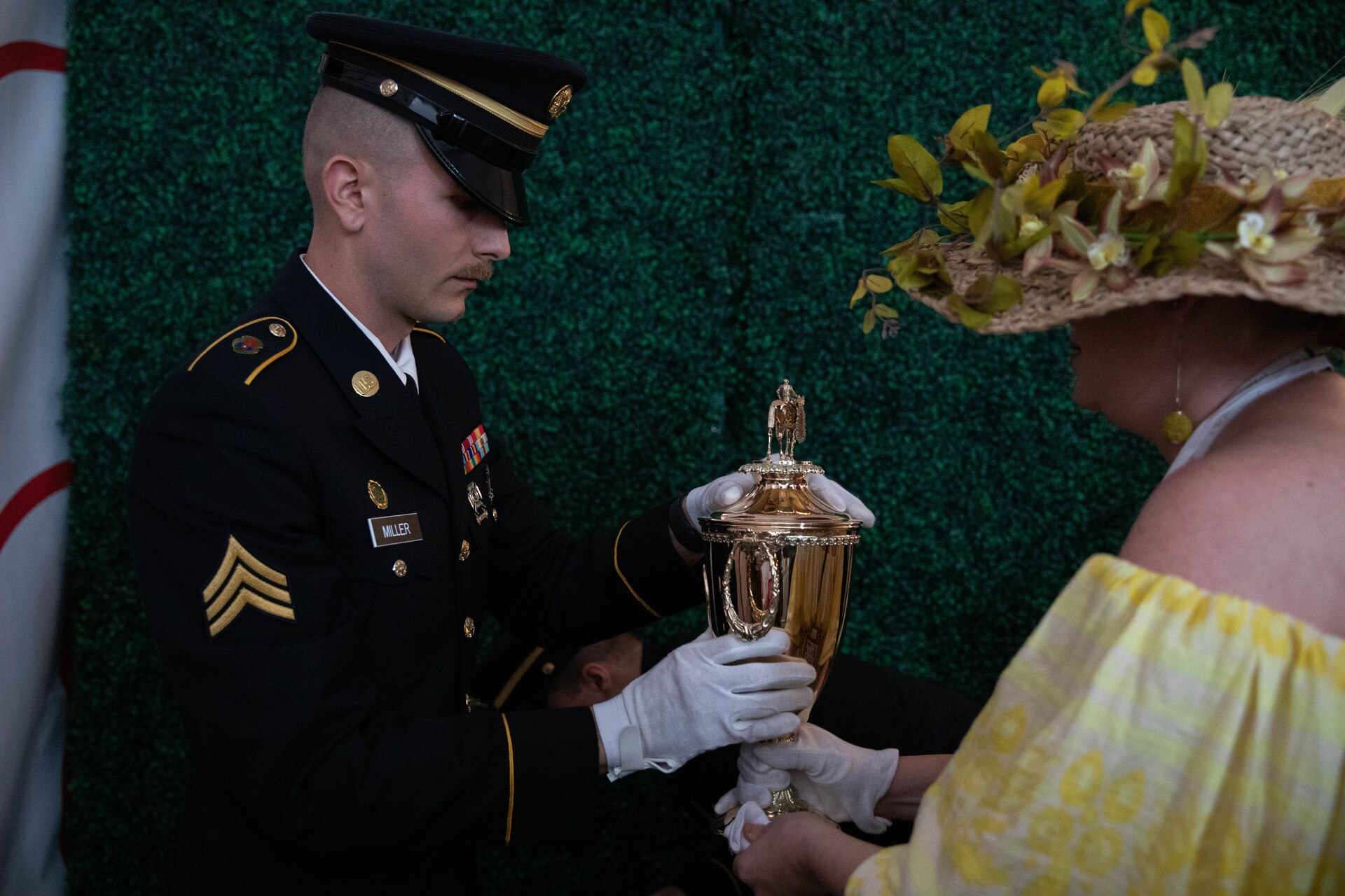 Soldiers of the 940th Military Police Company, 149th Maneuver Enhancement Brigade guard the winner’s trophy at the 150th Kentucky Derby at Churchill Downs, Louisville, Kentucky, May 4, 2024. The Kentucky Army National Guard carries a long tradition of escorting the winner’s cup dating back decades. (U.S. Army National Guard photo by Sergeant Caleb Sooter)