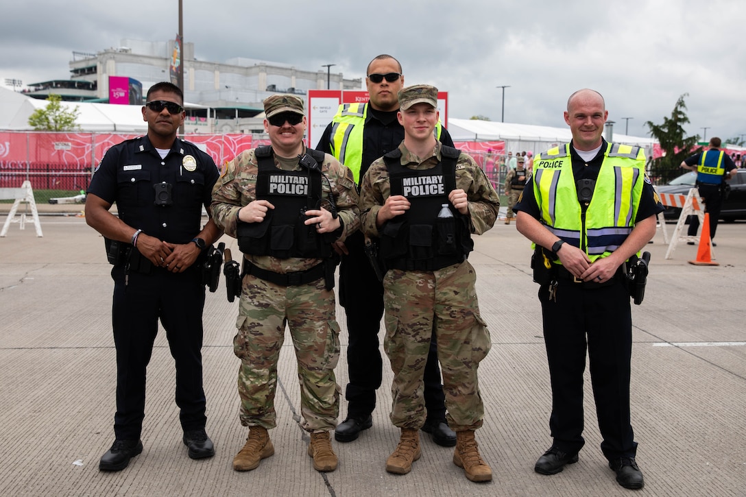 Soldiers of the 149th Maneuver Enhancement Brigade augment Louisville Metro Police Department officers in support of the 150th Kentucky Derby at Churchill Downs, Louisville, Kentucky, May 4, 2024. The Kentucky National guard has been assisting local police with traffic control and public safety during Derby season every year for the past 118 years. (U.S. Army National Guard photo by Sergeant Caleb Sooter)
