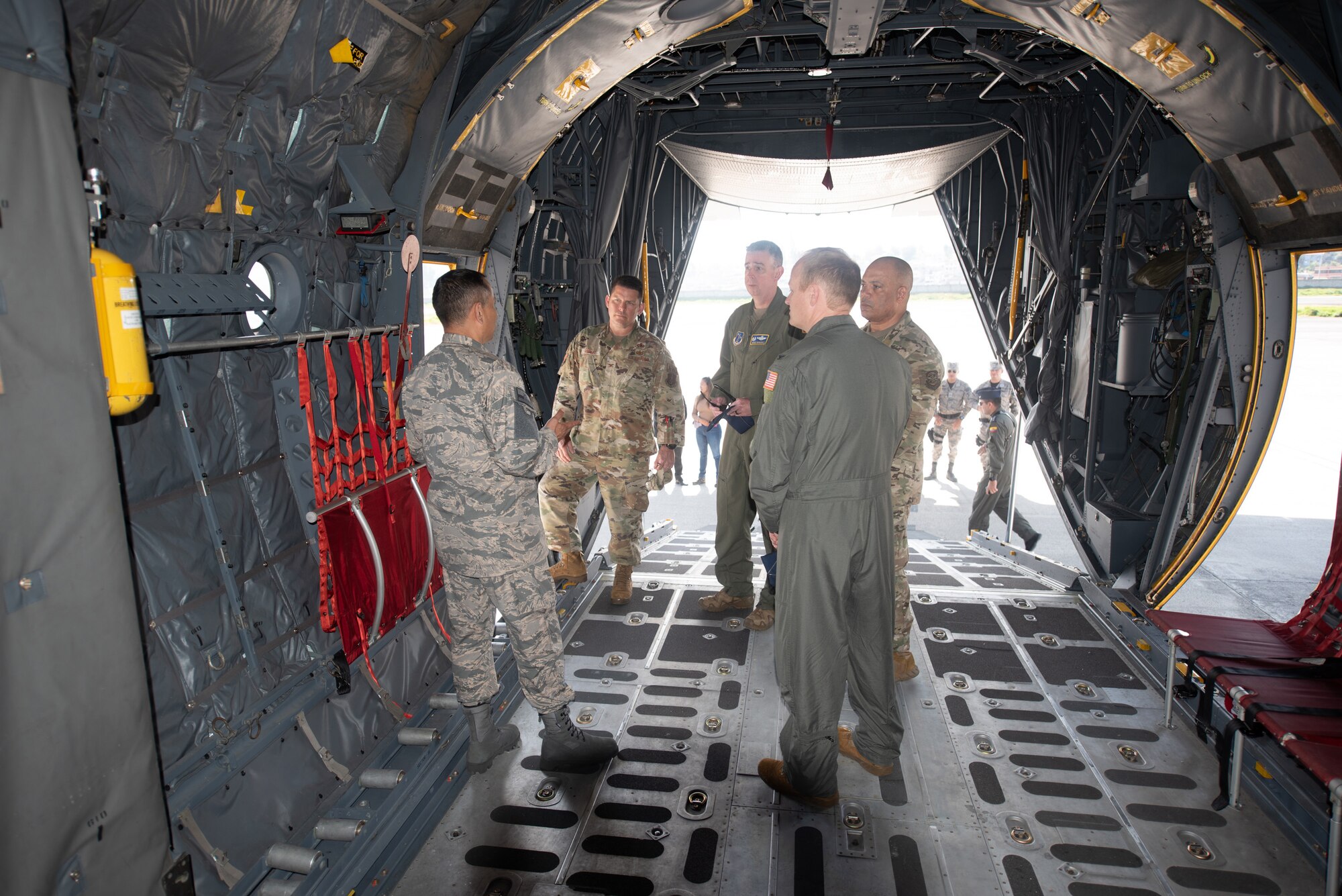 Ecuadorian Air Force Lt. Col. Brian Flores, left, liaison to the U.S. Embassy, speaks to Kentucky Air National Guard leaders before a ceremony welcoming the arrival of a C-130H Hercules to the Ecuadorian Air Force in Latacunga, Ecuador, March 25, 2024. The ceremony marked a new milestone in Ecuador’s participation in the National Guard Bureau State Partnership Program, which has paired Ecuador and the Kentucky National Guard for mutual military cooperation.