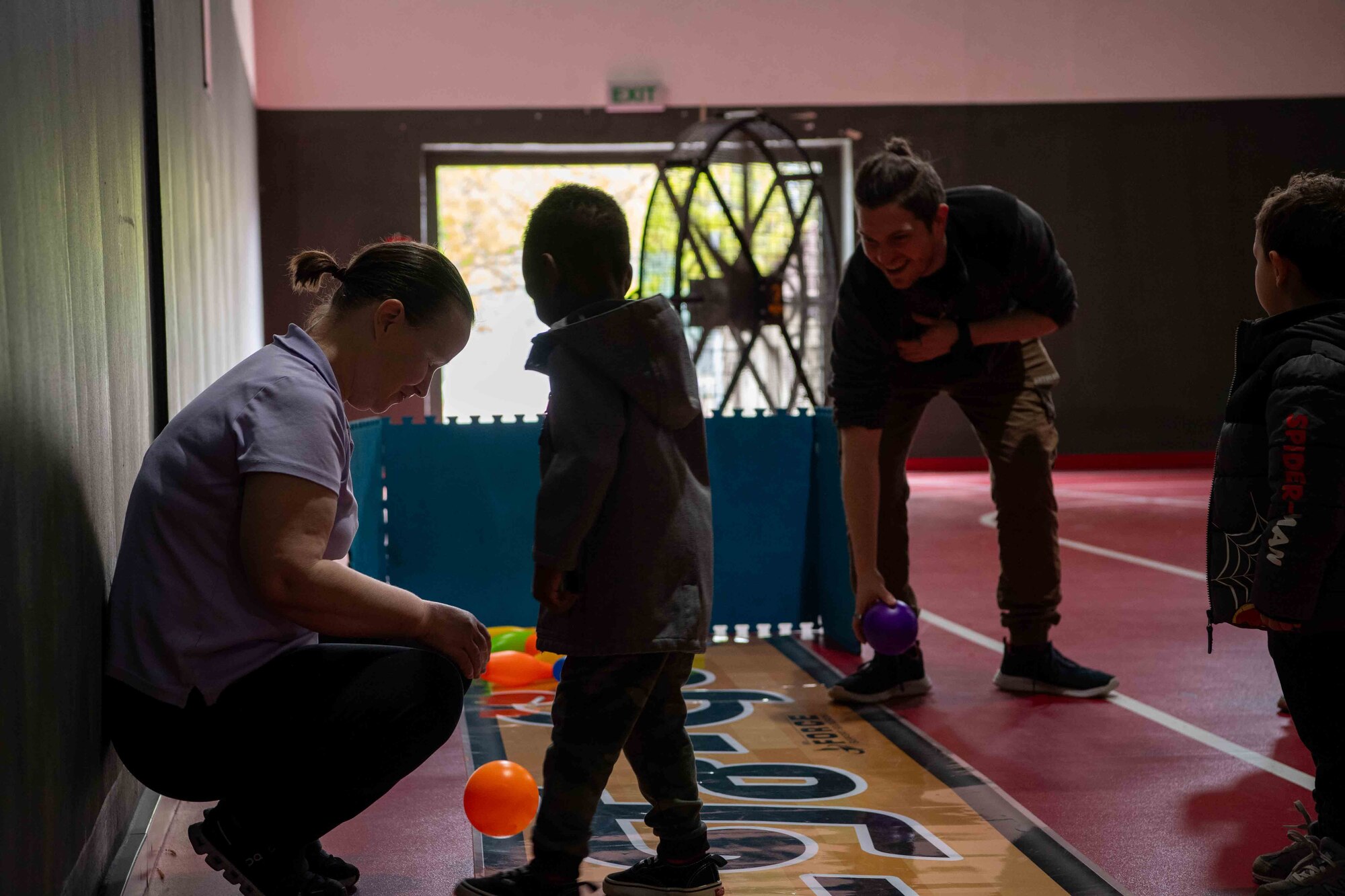 Ramstein Youth Center employees set up a childrens bowling station