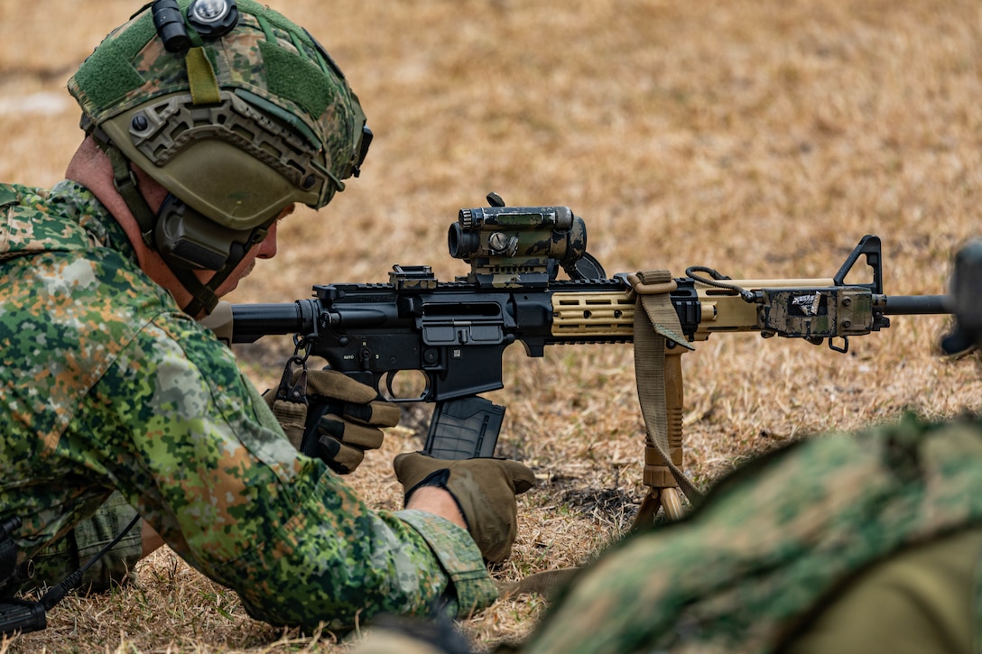 A Netherlands marine, assigned to the Marine Corps Squadron Caribbean, removes the magazine of his Colt C7/8 rifle in Barbados, during TRADEWINDS 24 (TW24) on May 4, 2024.
