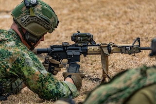 A Netherlands marine, assigned to the Marine Corps Squadron Caribbean, removes the magazine of his Colt C7/8 rifle in Barbados, during TRADEWINDS 24 (TW24) on May 4, 2024.