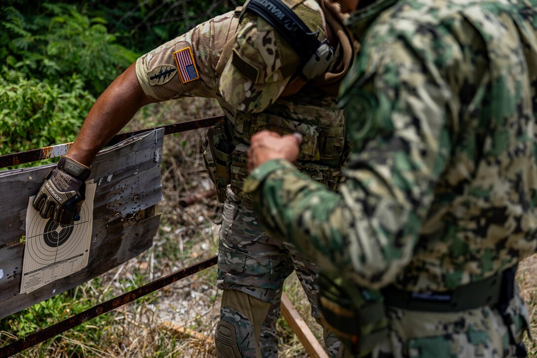 A 7th Special Forces Group (Airborne) Soldier provides weapons and marksmanship instruction to a Mexican marine in Barbados, during TRADEWINDS 24 (TW24) on May 4, 2024.