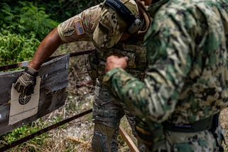 A 7th Special Forces Group (Airborne) Soldier provides weapons and marksmanship instruction to a Mexican marine in Barbados, during TRADEWINDS 24 (TW24) on May 4, 2024.