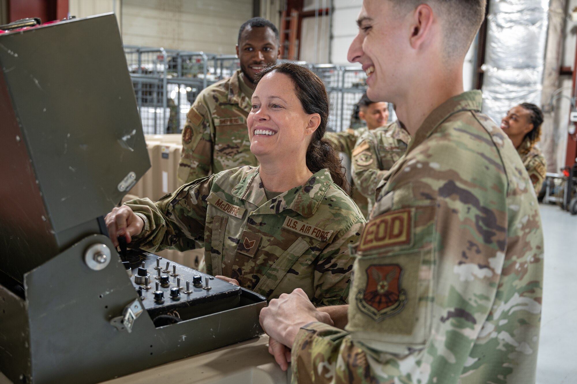Airmen look at a screen