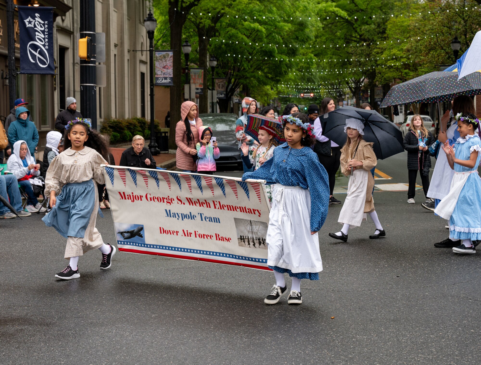 Kids from Maj. George S. Welch Elementary school, hold a school banner during the Dover Days Parade in Dover, Delaware, May 4, 2024. Students participated in the 91st Annual Dover Days Festival and Parade, an event that highlights the First State’s history and heritage. (U.S. Air Force photo by Airman 1st Class Amanda Jett)