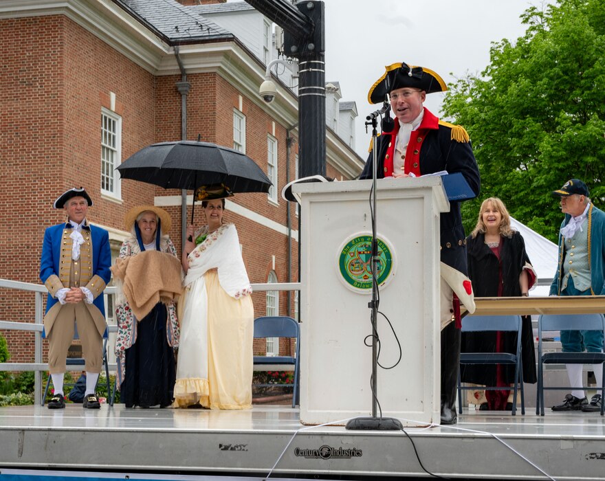 U.S. Air Force Col. Chris McDonald, 436th Airlift Wing commander, addresses parade attendees after the conclusion of the Dover Days parade in Dover, Delaware, May 4, 2024. McDonald and his wife dressed in colonial attire for the 91st Annual Dover Days Festival and Parade, an event that highlights the First State’s history and heritage. (U.S. Air Force photo by Airman 1st Class Amanda Jett)