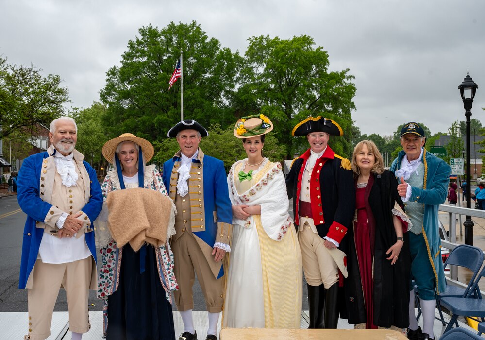 Members of Team Dover pose for a photo after the conclusion of the Dover Days parade in Dover, Delaware, May 4, 2024. The group dressed in colonial attire for the 91st Annual Dover Days Festival and Parade, an event that highlights the First State’s history and heritage. (U.S. Air Force photo by Airman 1st Class Amanda Jett)