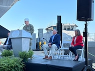Capt. Scot Searles, Unmanned Maritime Systems Program Manager, addresses attendees during the Vanguard christening ceremony, 25 April.