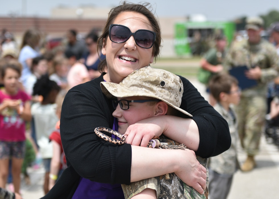 Jenna Jones, Goodfellow Honorary Commander, greets her child as he returns from his Operation K.I.D.S. (Kids Investigating Deployment Services) deployment at Goodfellow Air Force Base, Texas, April 27, 2024. Local and military children experienced what deployed service members may go through as they served their country. (U.S. Air Force photo by 2nd Lt. Harris Hillstead)