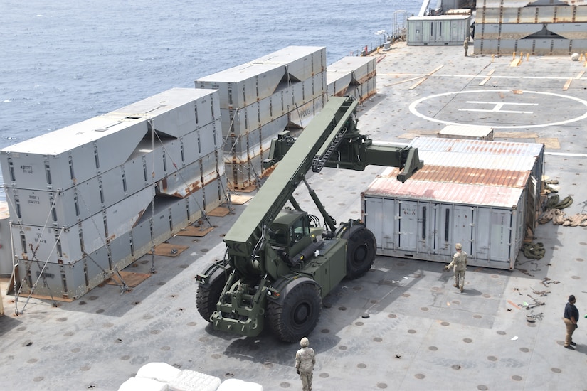 Soldiers construct a floating pier.