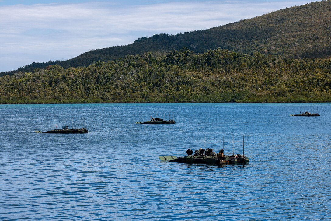 U.S. Marines assigned to Alpha Company, Battalion Landing Team 1/5, 15th Marine Expeditionary Unit, fire Mark 19 40mm grenade training rounds at simulated targets from amphibious combat vehicles during a waterborne gunnery live-fire training during Exercise Balikatan 24 in Oyster Bay, Philippines, May 4, 2024. BK 24 is an annual exercise between the Armed Forces of the Philippines and the U.S. military designed to strengthen bilateral interoperability, capabilities, trust, and cooperation built over decades of shared experiences. (U.S. Marine Corps photo by Cpl. Aidan Hekker)