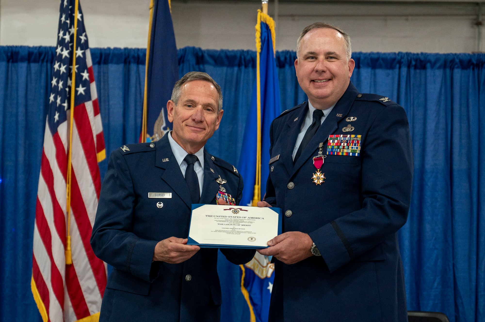United States Air Force Col. Charles Hutson, deputy commander of the 174th Attack Wing is presented with the Legion of Merit during his retirement ceremony at Hancock Field Air National Guard Base, May 4. Hutson received the award in recognition of his 30 years of service. (U.S. Air National Guard photo by Alexander Rector)
