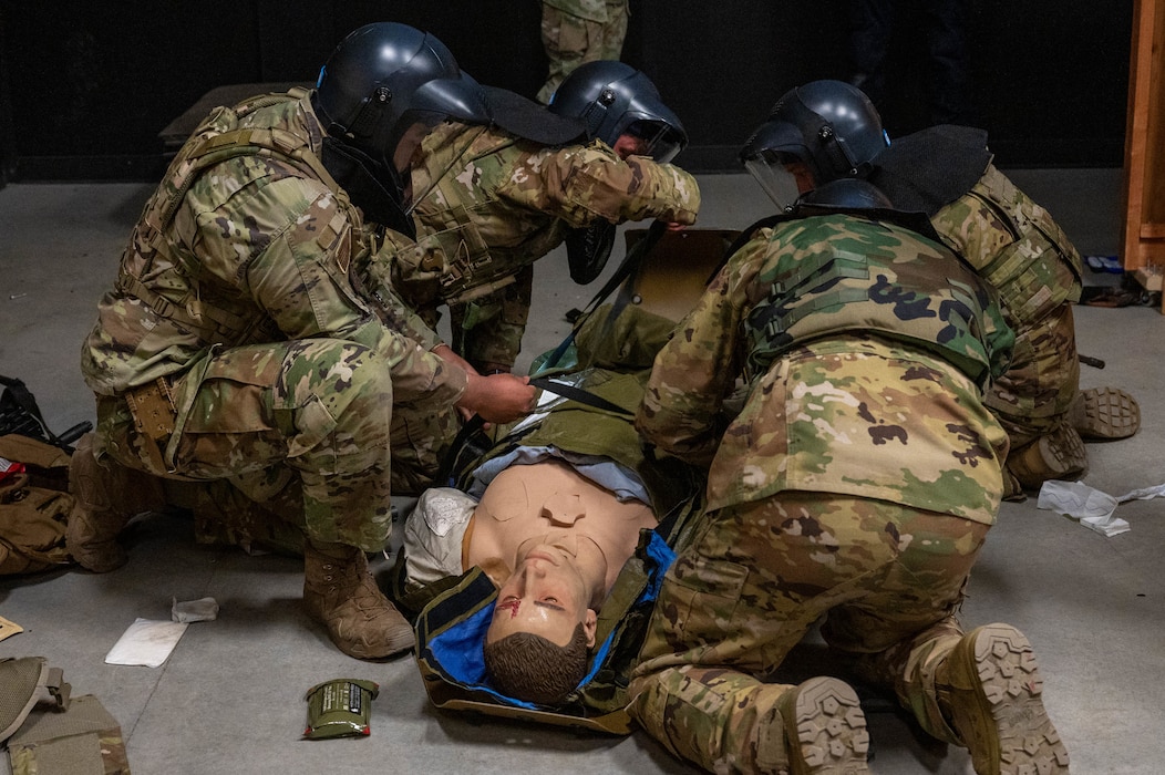 Airmen assigned to the 354th Fighter Wing provide simulated Tactical Combat Casualty Care at Eielson Air Force Base, Alaska, April 25, 2024.