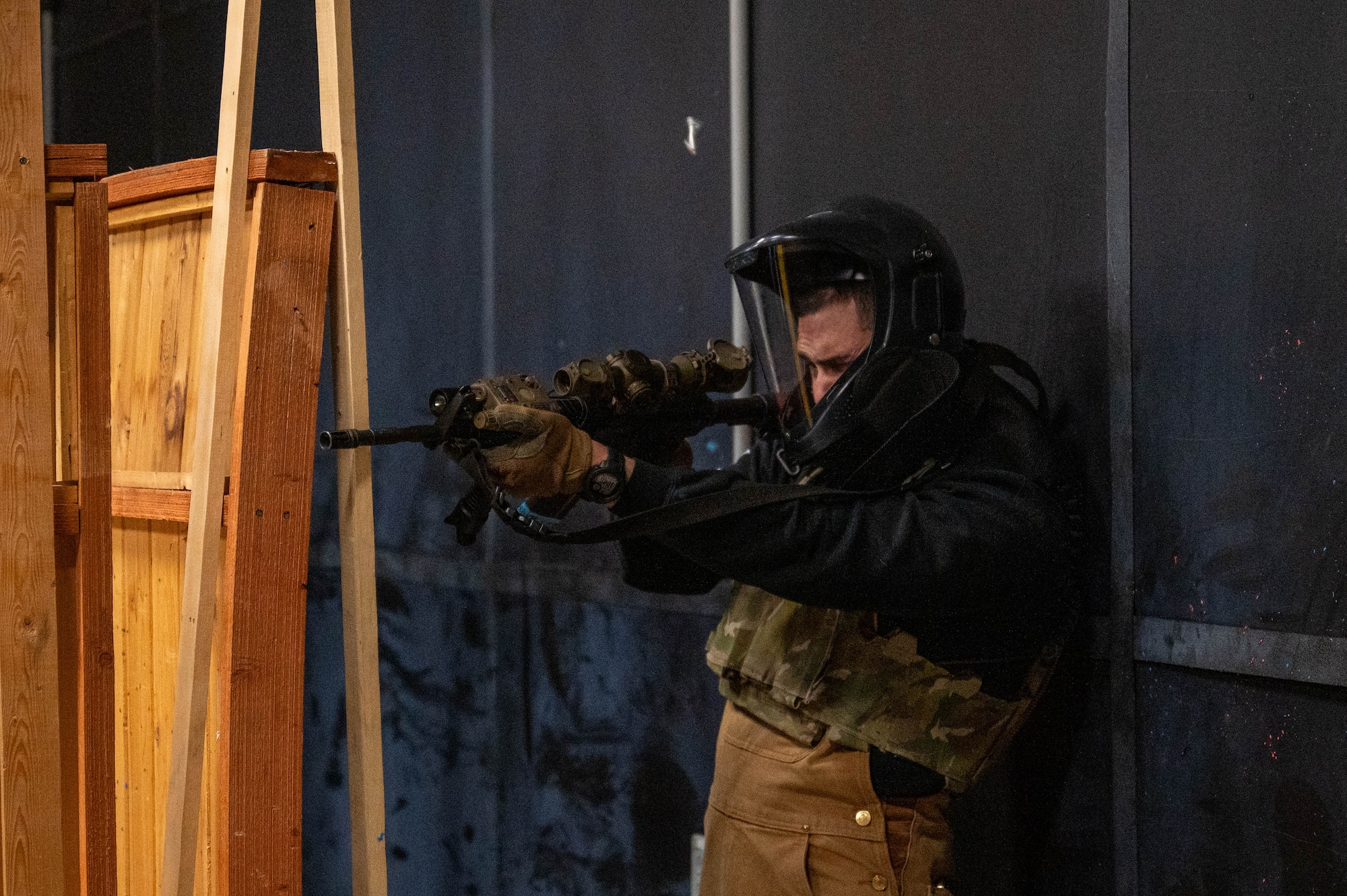 U.S. Air Force Senior Airman Ricardo Siqueiros, 354th Security Forces Squadron military working dog handler, fires sim rounds during a Tactical Combat Casualty Care scenario at Eielson Air Force Base, Alaska, April 25, 2024.