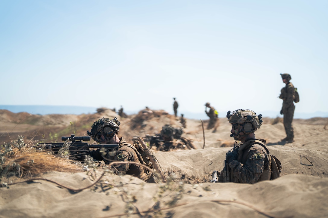 U.S. Marines with 3rd Littoral Combat Team, 3rd Marine Littoral Regiment, 3rd Marine Division, aim down range from a defensive position as part of a counter landing live-fire exercise during Exercise Balikatan 24 at La Paz Sand Dunes, Ilocos Norte, Philippines, May 6, 2024. BK 24 is an annual exercise between the Armed Forces of the Philippines and the U.S. military designed to strengthen bilateral interoperability, capabilities, trust, and cooperation built over decades of shared experiences. (U.S. Marine Corps photo by Cpl. Eric Huynh)