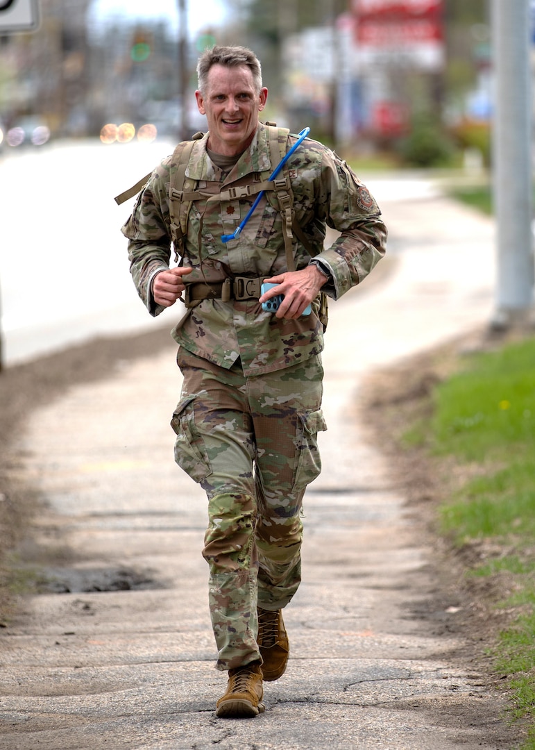 Maj. Heath Huffman of the 157th Air Refueling Wing approaches the finish line of the 18.6-mile Norwegian Foot March on May 4, 2024, in Concord, N.H.