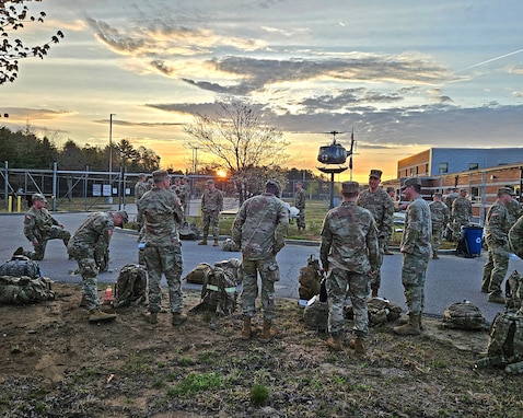 Sixty-one New Hampshire Guardsman muster at sunrise for the 18.6-mile Norwegian Foot March on May 4, 2024, at the Army Aviation Support Facility in Concord, N.H.