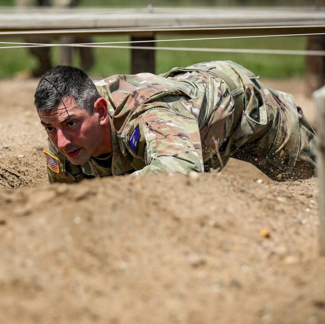 Staff Sgt. Alexander Kilbane, from the Wisconsin Army National Guard’s Headquarters Detachment, 2nd Battalion, 426th Regional Training Institute, navigates an obstacle course May 5 during the 2024 Region IV Best Warrior Competition at Camp Dodge, Iowa. Kilbane’s fellow competitor, Spc. Tevin Kenton of the 105th Cavalry Regiment, took first place in the lower enlisted division and will represent Wisconsin at the national Best Warrior Competition this August in Vermont. 135th Mobile Public Affairs Detachment photo