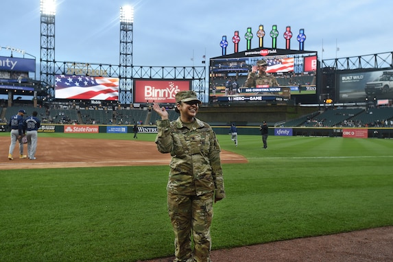 U.S. Army Reserve Staff Sgt. Christina House waves to the crowd, April 26, 2024, at Guaranteed Rate Field in Chicago, Illinois.