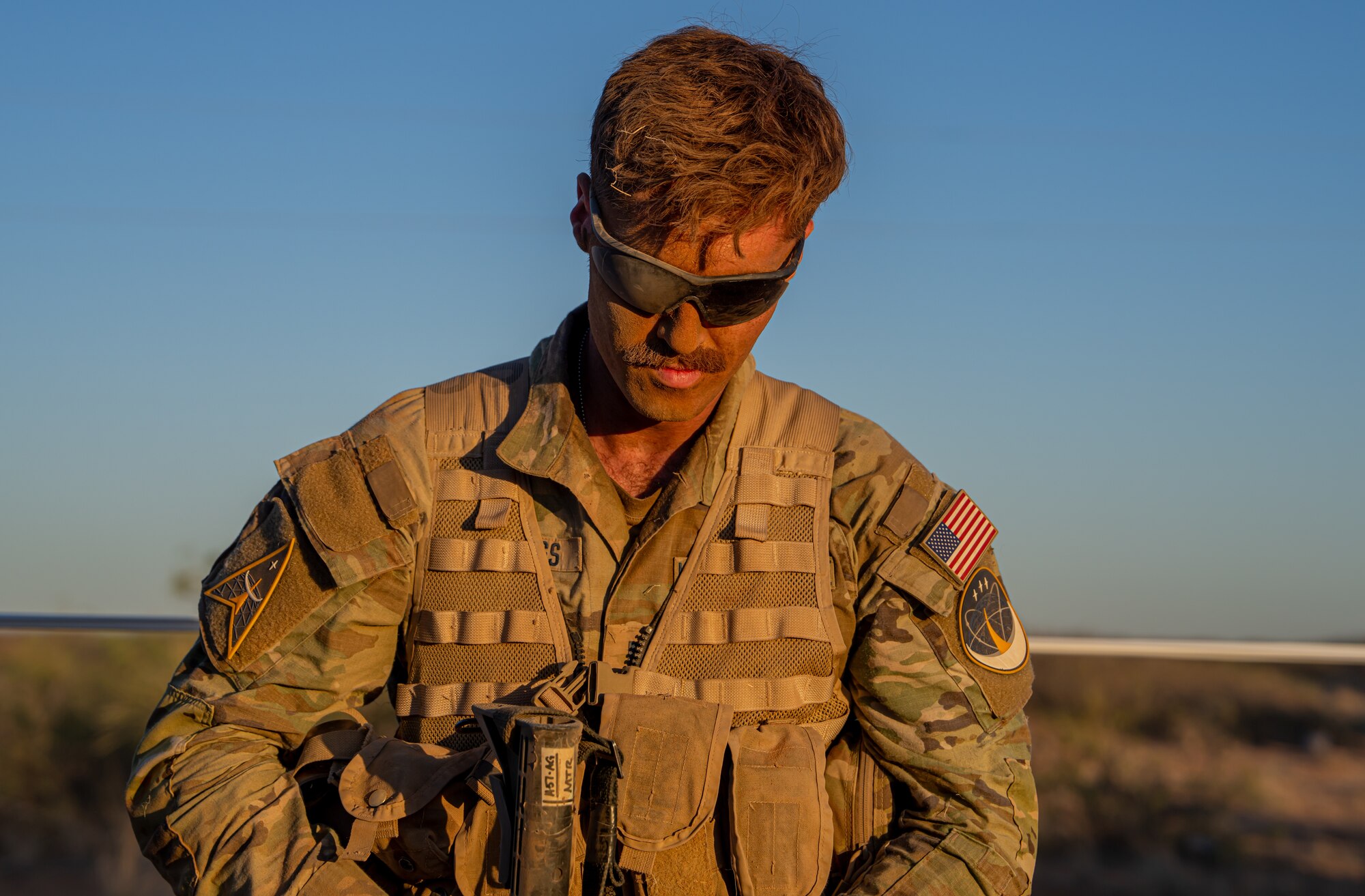 U.S. Space Force spur ride candidate takes a breather after completing a low crawl during a spur ride.