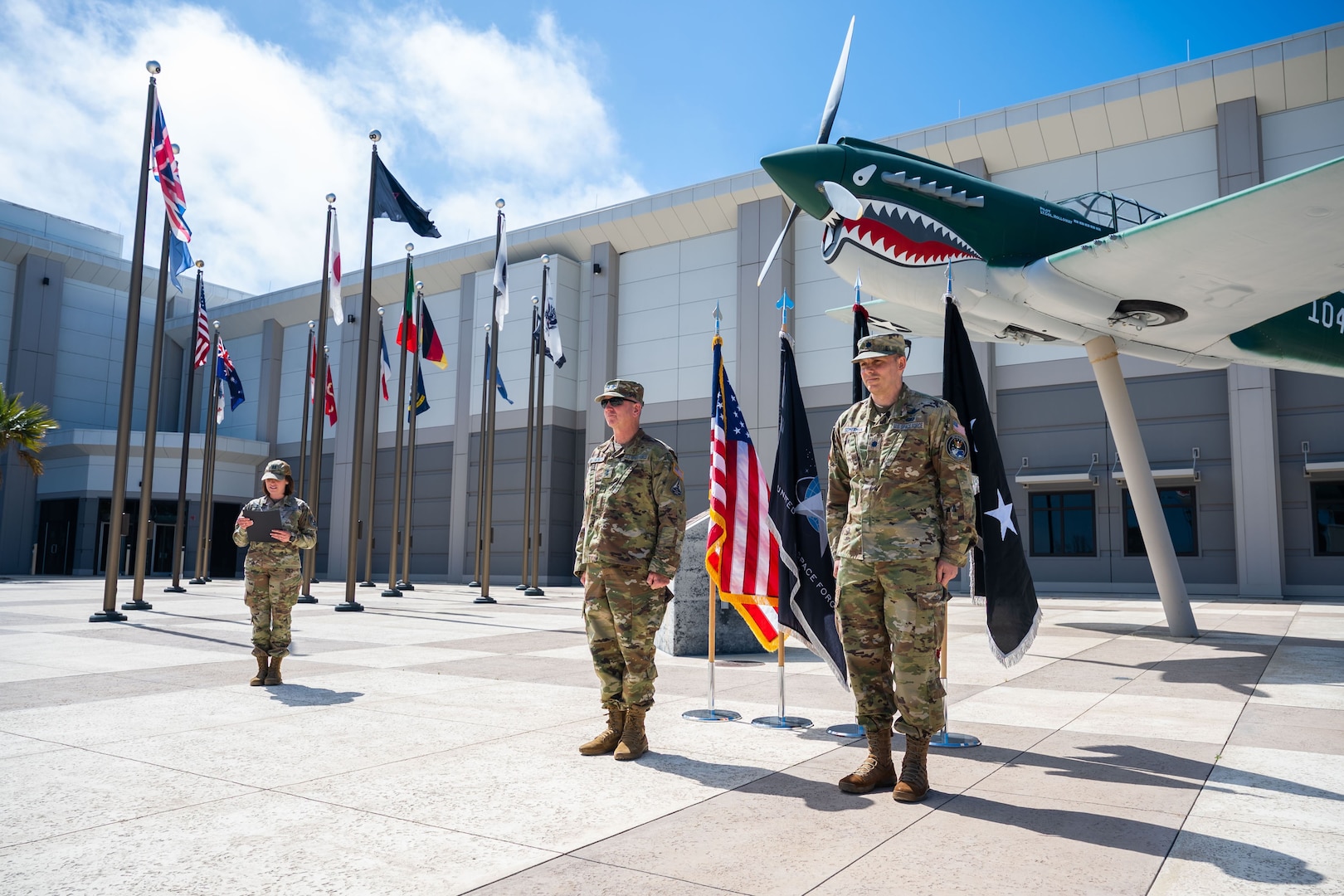 A general stands in front of a group during a promotion ceremony.