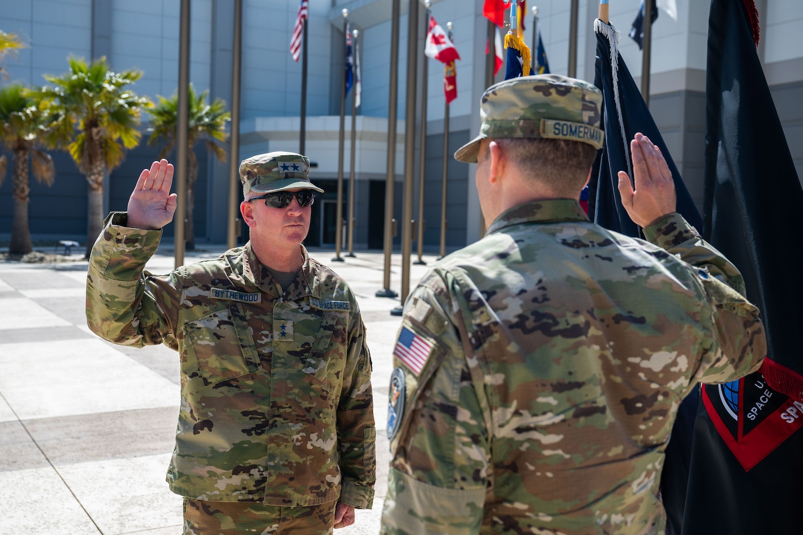A general stands in front of a group during a promotion ceremony.