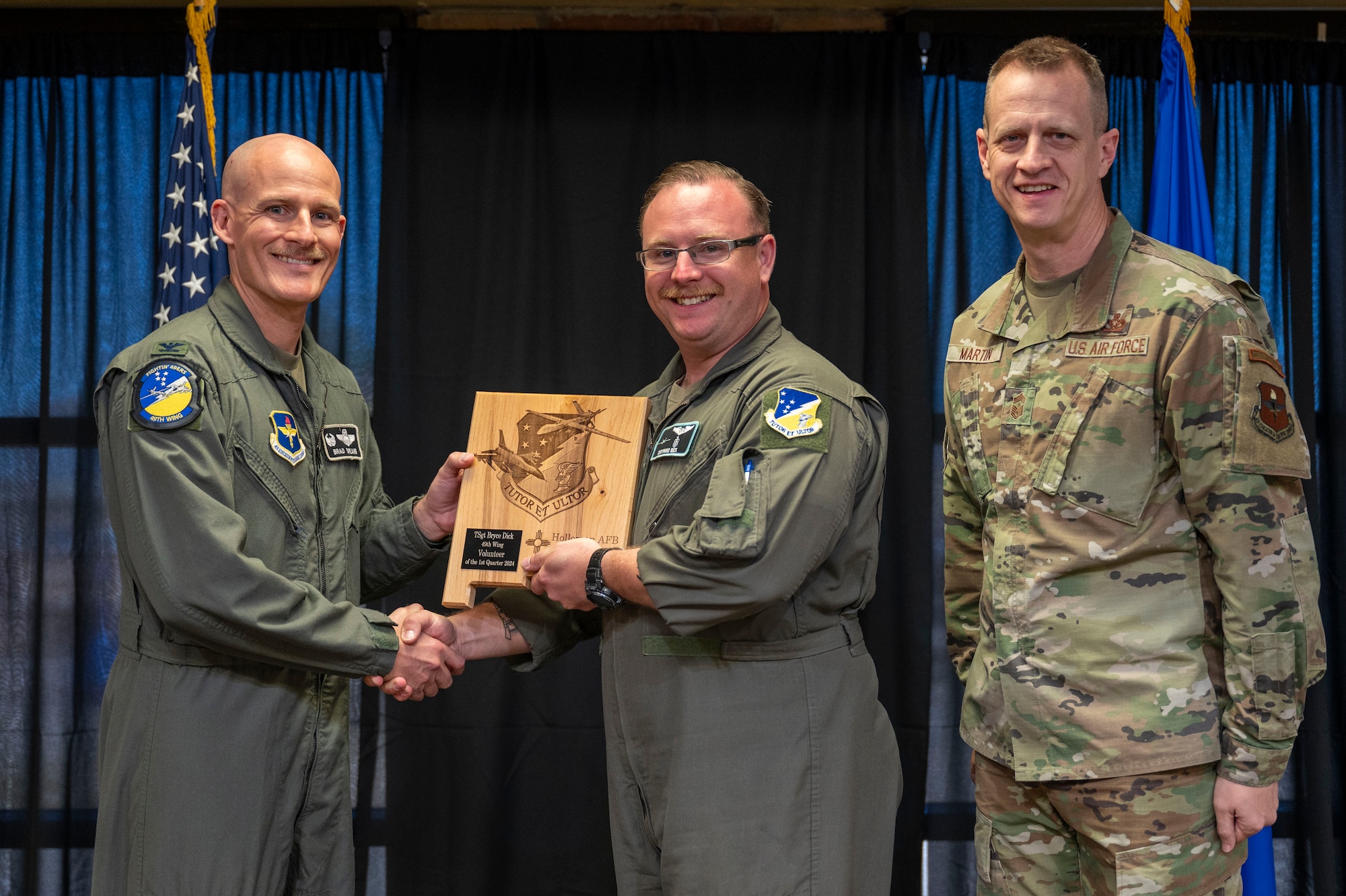 U.S. Air Force Tech. Sgt. Bryce Dick, 29th Attack Squadron flight chief, accepts the 49th Wing’s Volunteer of the First Quarter Award, during the 49th Wing’s 1st Quarter Award ceremony at Holloman Air Force Base, New Mexico, May 3, 2024. Quarterly award winners were selected based on their technical expertise, demonstration of leadership and job performance. (U.S. Air Force photo by Airman 1st Class Michelle Ferrari)
