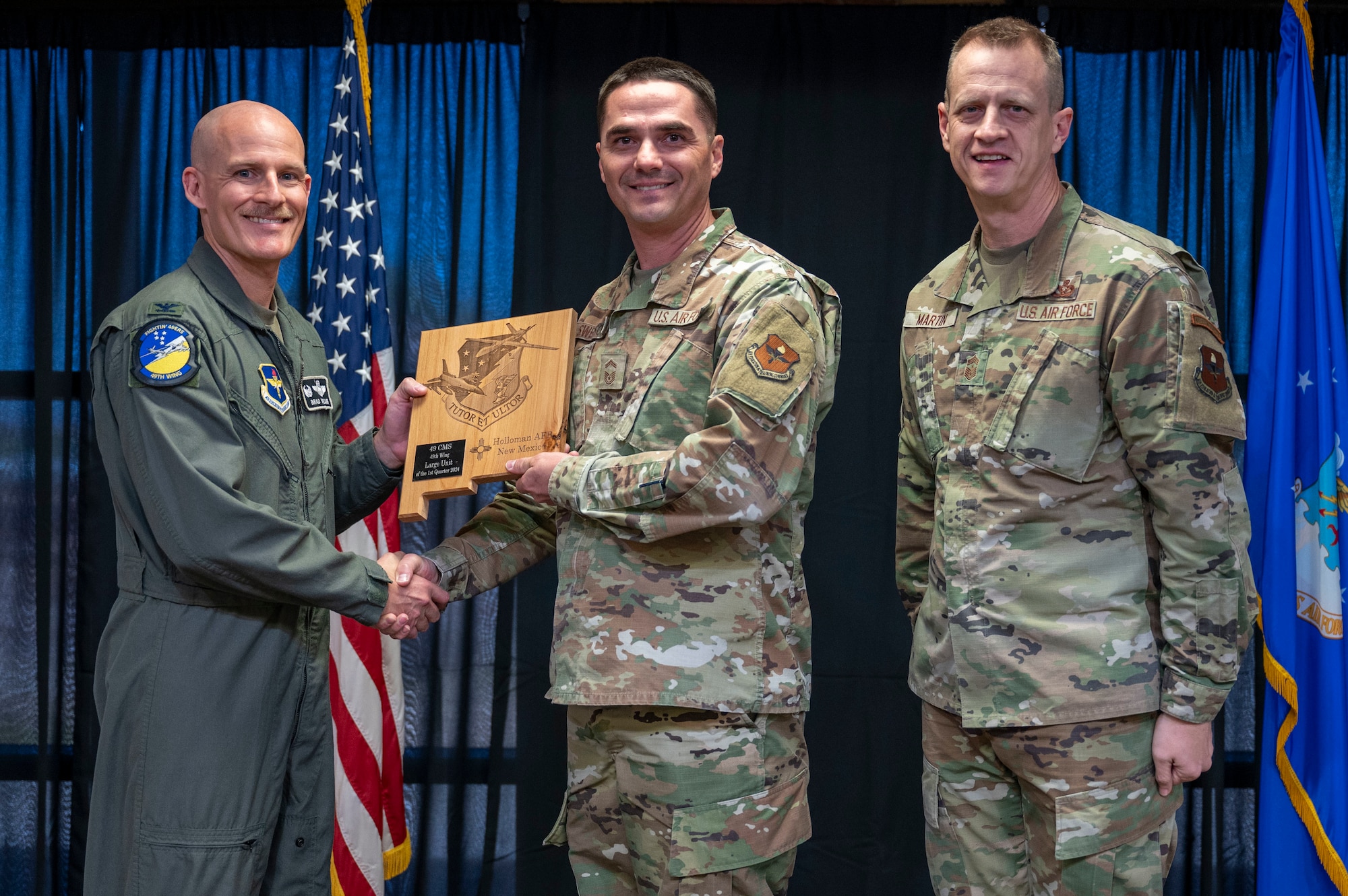 U.S. Air Force Senior Master Sgt. Troy Swenson, from the 49th Component Maintenance Squadron, accepts the 49th Wing’s Large Unit of the Quarter Award, during the 49th Wing’s 1st Quarter Award ceremony at Holloman Air Force Base, New Mexico, May 3, 2024. Quarterly award winners were selected based on their technical expertise, demonstration of leadership and job performance. (U.S. Air Force photo by Airman 1st Class Michelle Ferrari)