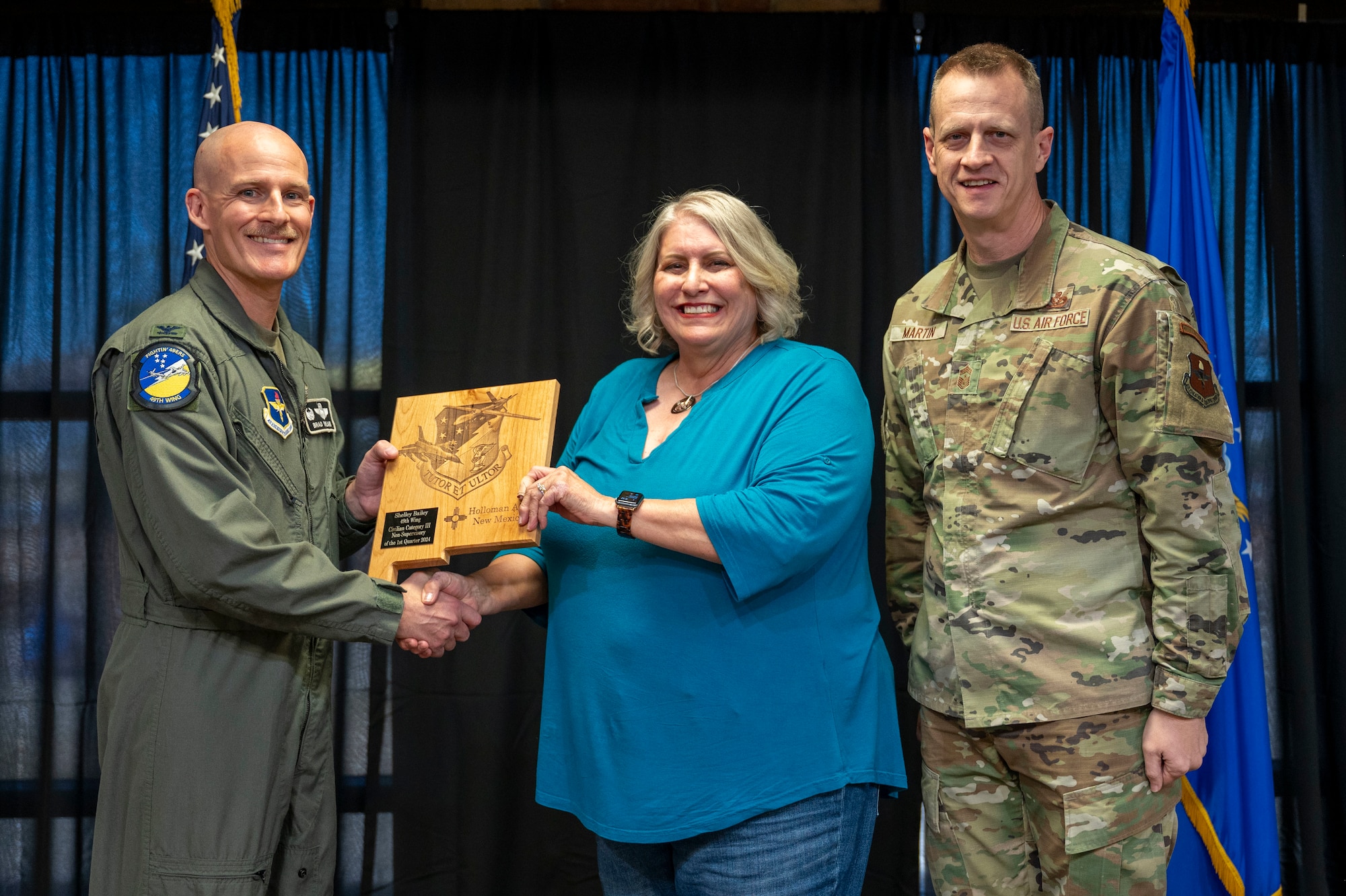 Shelley Bailey, 49th Wing Public Affairs chief of community engagement, accepts the 49th Wing Category III Non-Supervisory Civilian of the Quarter Award, during the 49th Wing’s 1st Quarter Award ceremony at Holloman Air Force Base, New Mexico, May 3, 2024. Quarterly award winners were selected based on their technical expertise, demonstration of leadership and job performance. (U.S. Air Force photo by Airman 1st Class Michelle Ferrari)