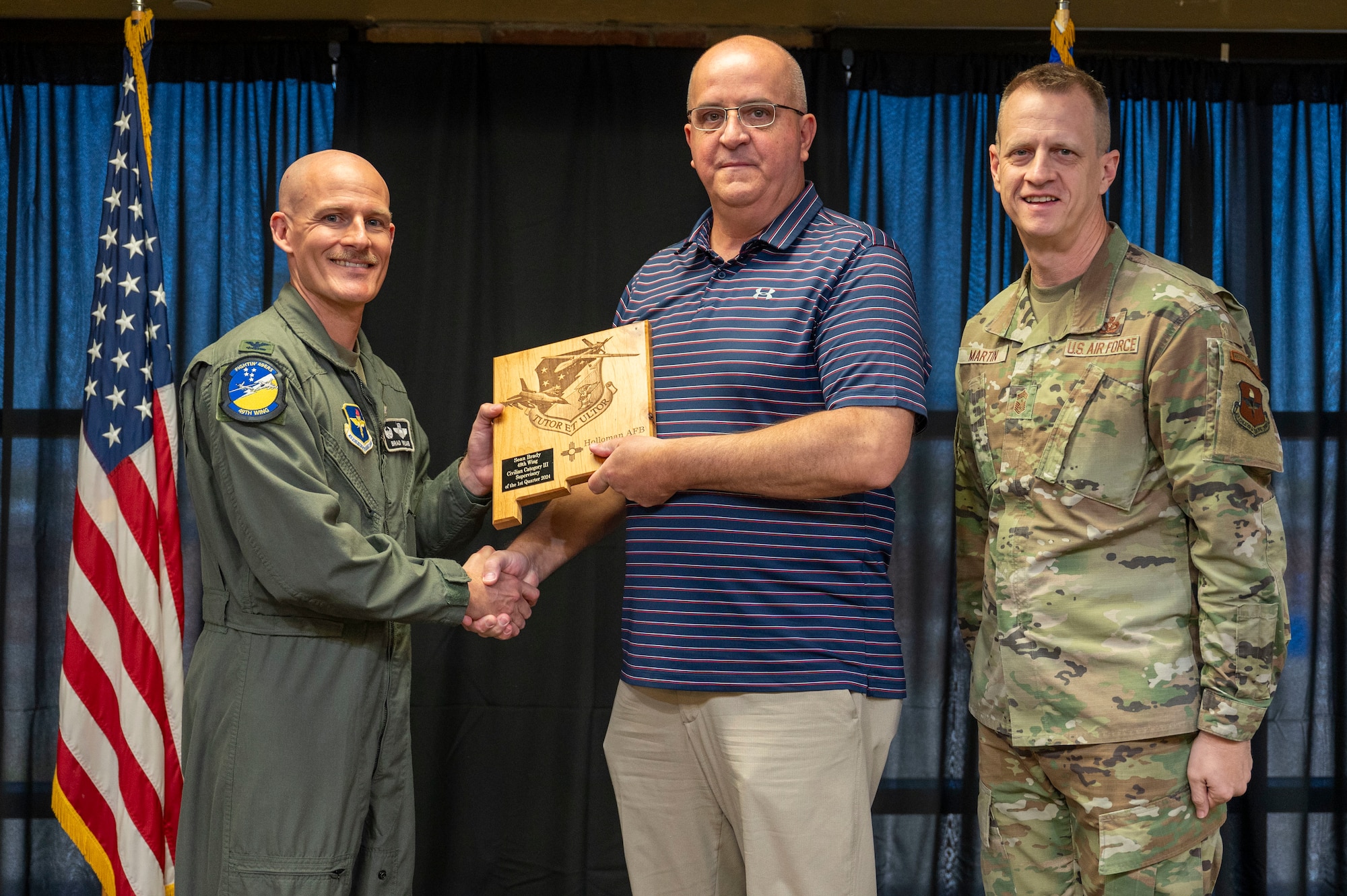 Sean Brady, 54th Operations Support Squadron airfield manager, accepts the 49th Wing Category III Supervisory Civilian of the Quarter Award, during the 49th Wing’s 1st Quarter Award ceremony at Holloman Air Force Base, New Mexico, May 3, 2024. Quarterly award winners were selected based on their technical expertise, demonstration of leadership and job performance. (U.S. Air Force photo by Airman 1st Class Michelle Ferrari)