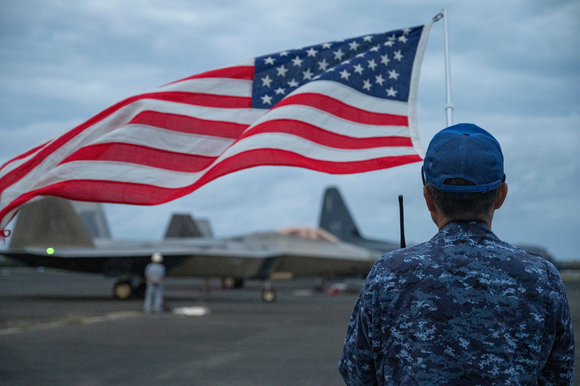 A member of the Japan Self Defense Force holds an American Flag