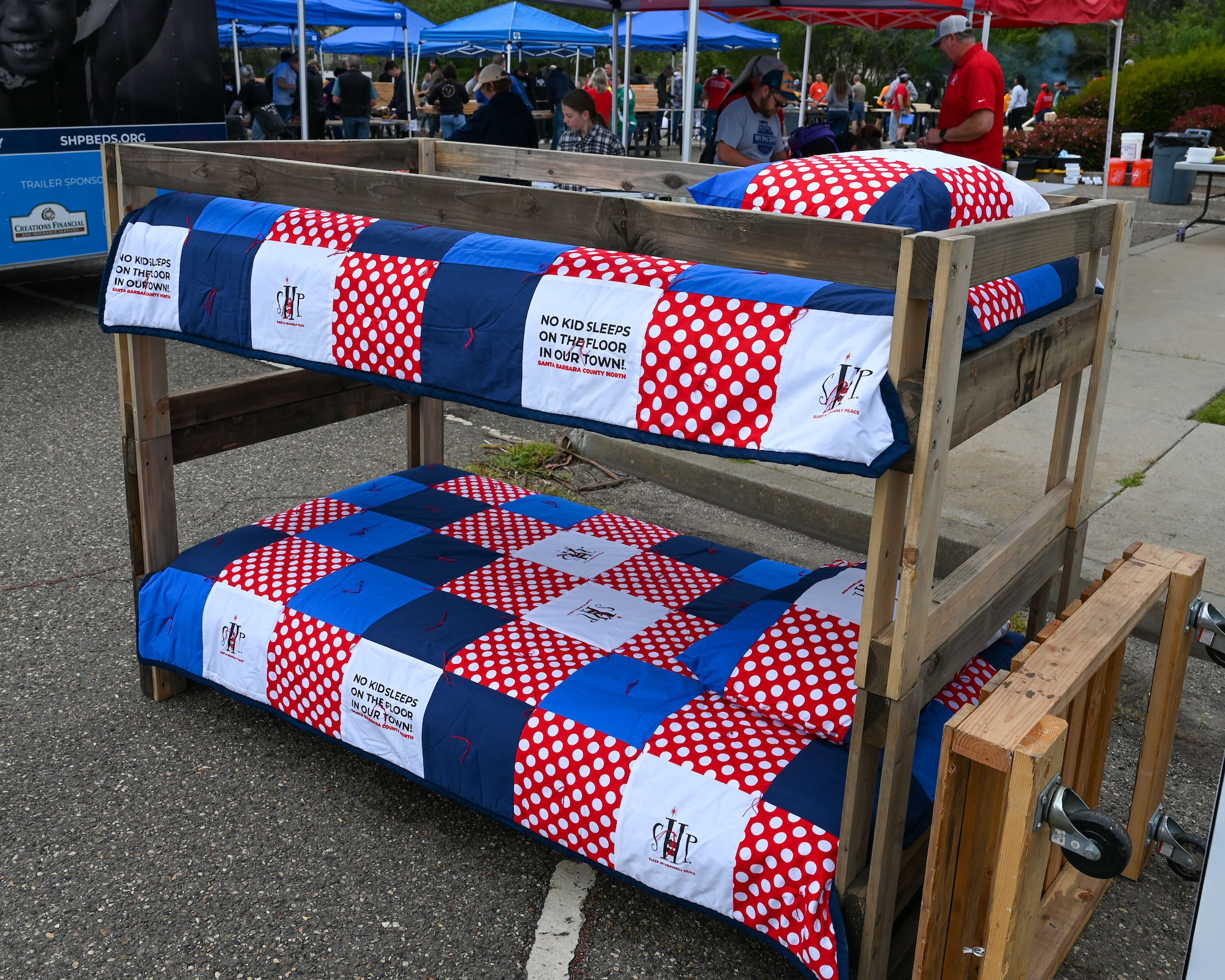 A completed bunkbed stands outside as a reference.