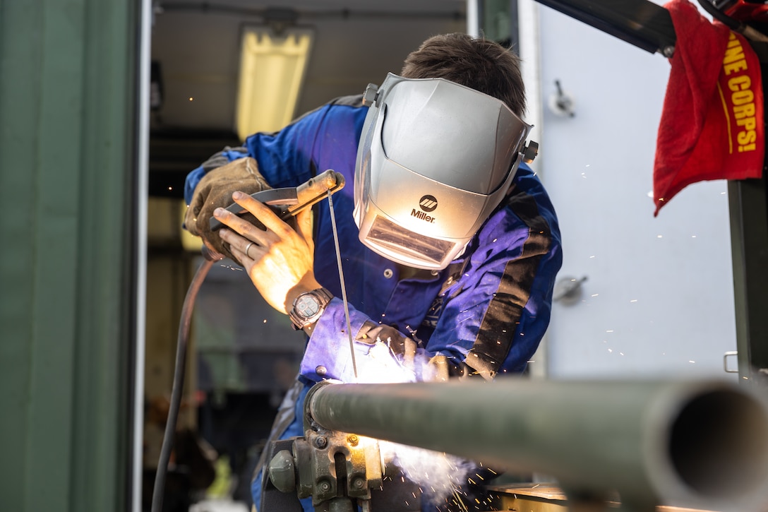 U.S. Marine Corps Pfc. Steven Rosche, a machinist with 3rd Maintenance Battalion, 3rd Marine Logistics Group, welds a pipe together during a Marine Corps Combat Readiness Evaluation (MCCRE) at Camp Schwab, Japan, April 18, 2024. Rosche is a native of New York. The purpose of a MCCRE is to formally evaluate the unit’s core assigned tasks in order to ensure unit standardization and combat readiness. (U.S. Marine Corps photo by Sgt. Christian M. Garcia)