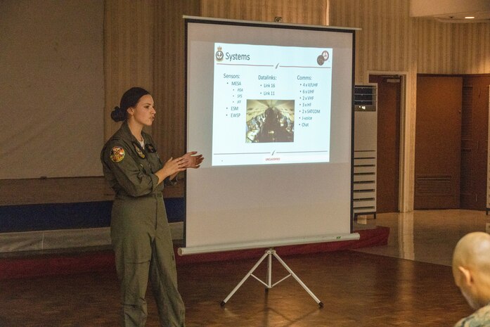 Royal Australian Air Force FLGOFF Ash Johnston, an air battle manager with 2 Squadron, Royal Australian Air Force, discusses Integrated Air & Missile Defense systems with U.S., Australian, and Philippine service members during Exercise Balikatan 24 at Clark Air Base, Angeles, Philippines, April 22, 2024. BK 24 is an annual exercise between the Armed Forces of the Philippines and the U.S. military designed to strengthen bilateral interoperability, capabilities, trust, and cooperation built over decades of shared experiences. (U.S. Marine Corps photo by Cpl. Nayomi Koepke)