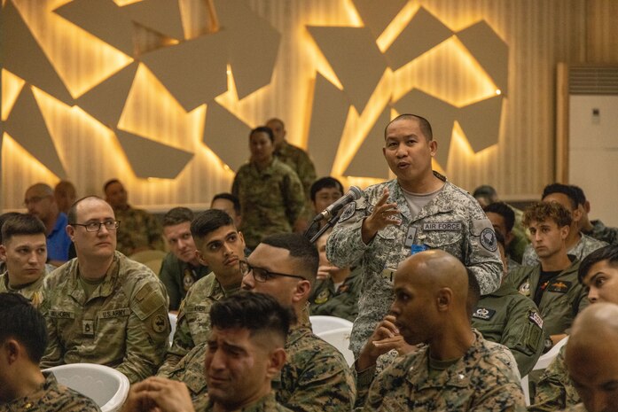 Philippine Air Force 2nd Lt. Ralison Quiambao, an operations officer with the Direct Air Support Force, asks a question at an Integrated Air & Missile Defense subject matter expert exchange during Exercise Balikatan 2024 at Clark Air Base, Angeles, Philippines, April 22, 2024. BK 24 is an annual exercise between the Armed Forces of the Philippines and the U.S. military designed to strengthen bilateral interoperability, capabilities, trust, and cooperation built over decades of shared experiences. (U.S. Marine Corps photo by Cpl. Nayomi Koepke)