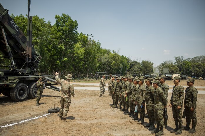 U.S. Army 1st Lt. Christian de Jong, Bravo Battery, 1-1 Air Defense Artillery, 38th Air Defense Brigade, teaches members of the Philippine Army about the MIM-104 Patriot System as part of the Joint Integrated Air And Missile Defense exchange during Exercise Balikatan 24 at Clark Air Base, Philippines, April 25, 2024. BK 24 is an annual exercise between the Armed Forces of the Philippines and the U.S. military designed to strengthen bilateral interoperability, capabilities, trust, and cooperation built over decades of shared experiences. (U.S. Army photo by Maj. Trevor Wild)