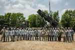 Service members from the Armed Forces of the Philippines, U.S. Military, and Japan Air Self-Defense Force stand in front of the Patriot M903 Launching Station belonging to Bravo Battery, 1-1 Air Defense Artillery, as part of the week-long Joint Integrated Air And Missile Defense exchange during Exercise Balikatan 24 at Clark Air Base, Philippines, April 25, 2024. BK 24 is an annual exercise between the Armed Forces of the Philippines and the U.S. military designed to strengthen bilateral interoperability, capabilities, trust, and cooperation built over decades of shared experiences. (U.S. Army photo by Maj. Trevor Wild)
