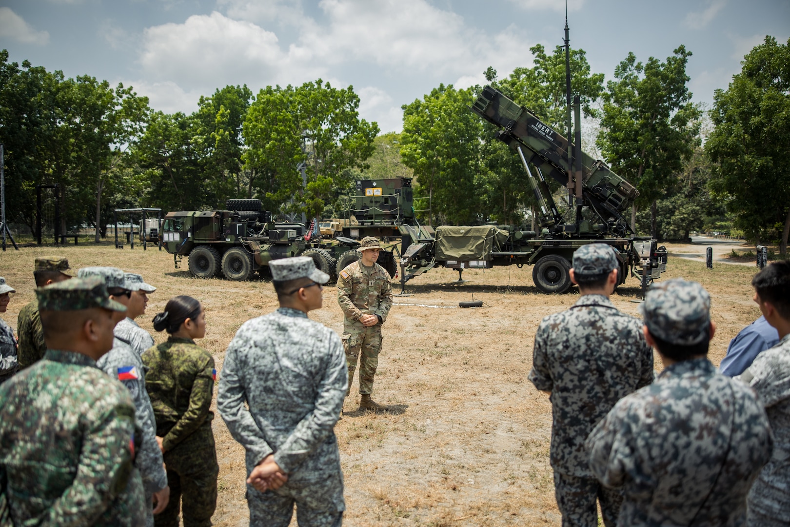 U.S. Army 1st Lt. Christian de Jong, Bravo Battery, 1-1 Air Defense Artillery, 38th Air Defense Brigade, listens to questions in front of the M903 Launching Station for the MIM-104 Patriot System as part of the Joint Integrated Air And Missile Defense exchange during Exercise Balikatan 24 at Clark Air Base, Philippines, April 25, 2024. BK 24 is an annual exercise between the Armed Forces of the Philippines and the U.S. military designed to strengthen bilateral interoperability, capabilities, trust, and cooperation built over decades of shared experiences. (U.S. Army photo by Maj. Trevor Wild)