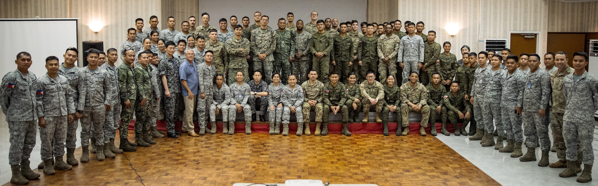 Service members from the U.S. Military, Armed Forces of the Philippines, and Japan Air Self-Defense Force pose for a photo after a week-long Joint Integrated Air And Missile Defense exchange during Exercise Balikatan 24 at Clark Air Base, Philippines, April 25, 2024. BK 24 is an annual exercise between the Armed Forces of the Philippines and the U.S. military designed to strengthen bilateral interoperability, capabilities, trust, and cooperation built over decades of shared experiences. (U.S. Army photo by Maj. Trevor Wild)