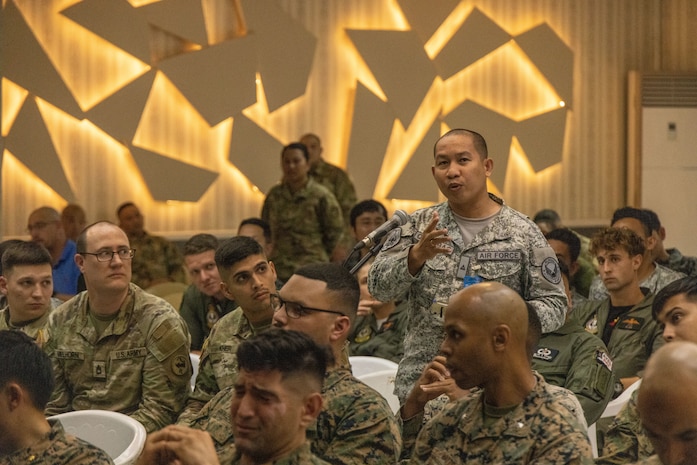 Philippine Air Force 2nd Lt. Ralison Quiambao, an operations officer with the Direct Air Support Force, asks a question at an Integrated Air & Missile Defense subject matter expert exchange during Exercise Balikatan 2024 at Clark Air Base, Angeles, Philippines, April 22, 2024. BK 24 is an annual exercise between the Armed Forces of the Philippines and the U.S. military designed to strengthen bilateral interoperability, capabilities, trust, and cooperation built over decades of shared experiences. (U.S. Marine Corps photo by Cpl. Nayomi Koepke)