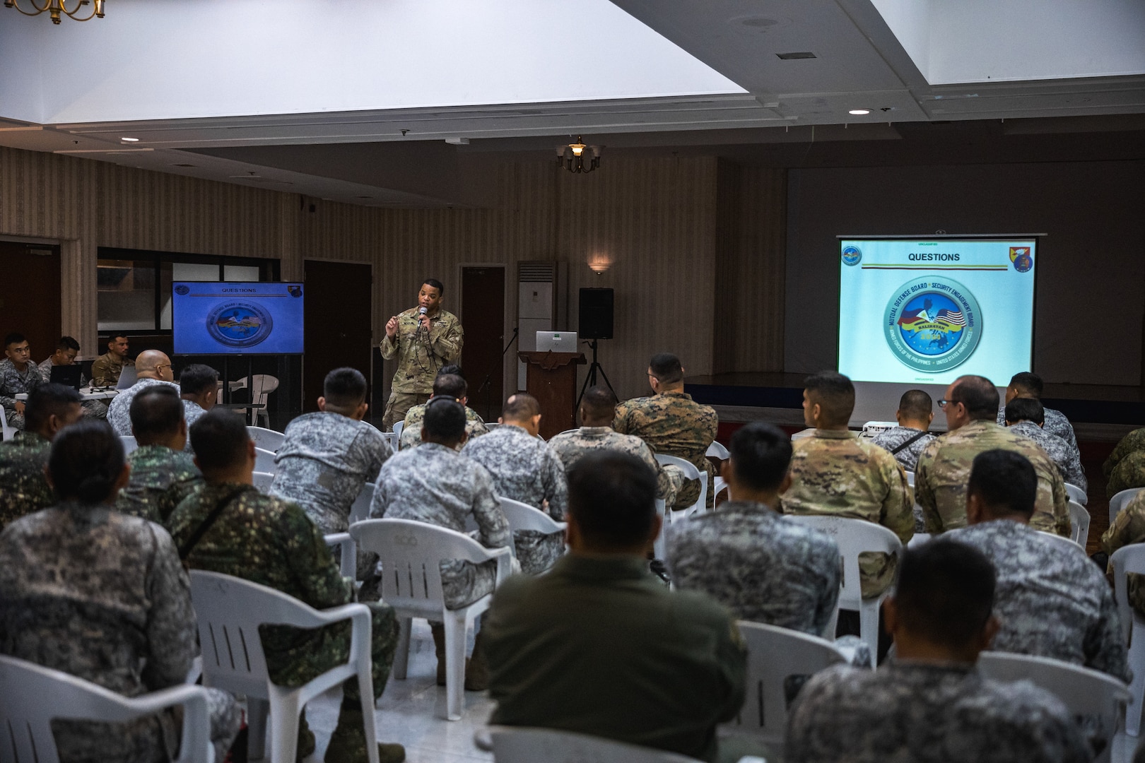 U.S. Army Capt. Rishad Readus, assistant operations officer, 38th Air Defense Artillery Brigade, speaks to the multilateral attendees of the Joint Integrated Air And Missile Defense exchange during Exercise Balikatan 24 at Clark Air Base, Philippines, April 25, 2024. BK 24 is an annual exercise between the Armed Forces of the Philippines and the U.S. military designed to strengthen bilateral interoperability, capabilities, trust, and cooperation built over decades of shared experiences. (U.S. Army photo by Maj. Trevor Wild)