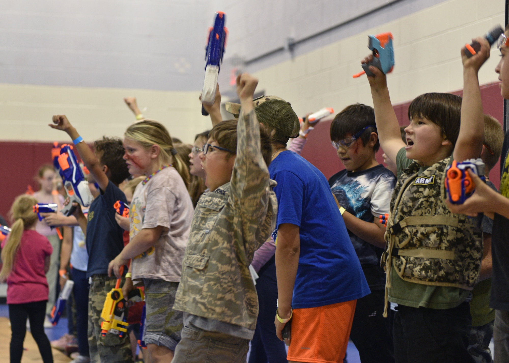 Operation K.I.D.S. (Kids Investigating Deployment Services) participants prepare for a foam dart gun battle at Goodfellow Air Force Base, Texas, April 27, 2024. Participants put together all of their training from the day to apply it in a battle scenario. (U.S. Air Force photo by 2nd Lt. Harris Hillstead)